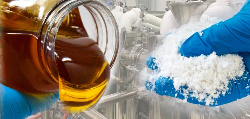 “Laboratory scene showing amber cannabis distillate being poured from a glass jar on the left, and blue-gloved hands holding a mound of white cannabinoid isolate on the right, with stainless steel processing equipment in the background.”